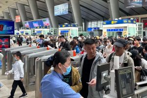 Beijing's railway stations saw exceptionally heavy passenger loads on May 1, day one of a five-day national break.